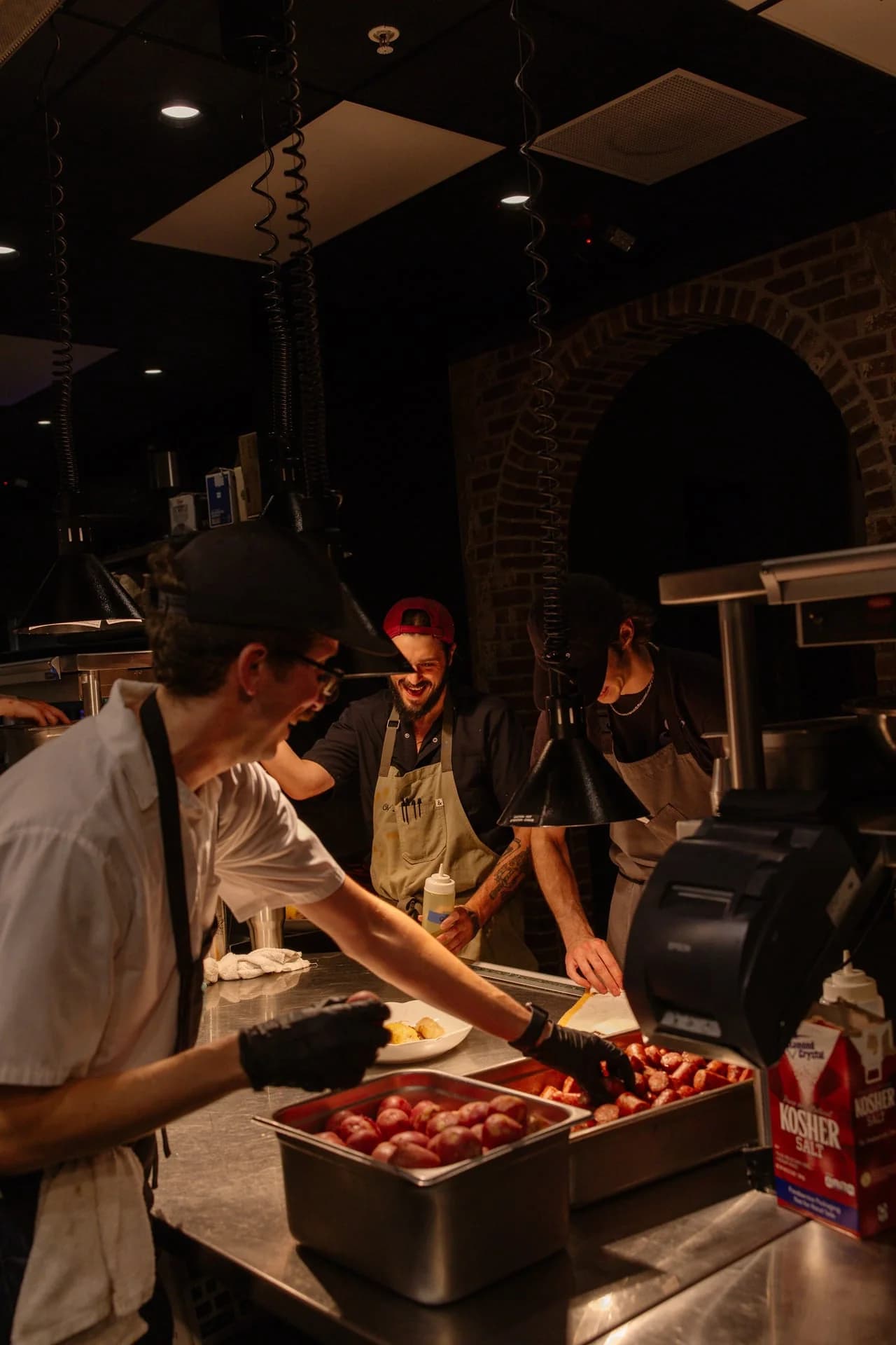 Carmelo's kitchen team prepping house-made Italian sausage